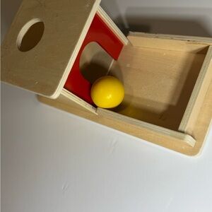 Interactive Wooden Toy Box with Red and Yellow Accents